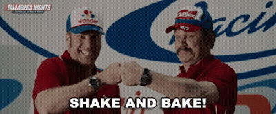 Two Men Shaking Hands In Front Of Talladega Nights Sign GIF