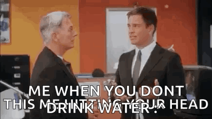 Two Men Shaking Hands In Office GIF