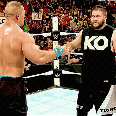 Two Men Shaking Hands In Wrestling Ring One Wearing KO Shirt GIF