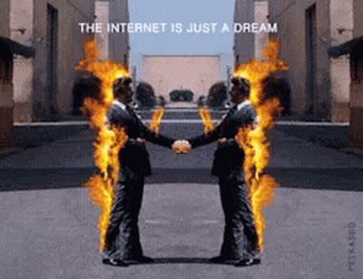 Two Men Shaking Hands With Flames Coming Out Of Their Bodies And The Words The Internet Is Just A Dream GIF