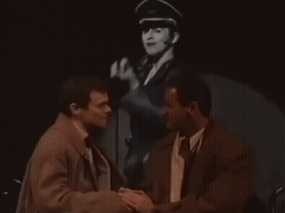 Two Men Shaking Hands With Man In Military Hat GIF
