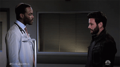 Two Men Shaking Hands With NBC Logo GIF