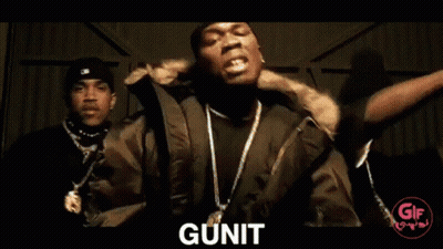 Two Men Sit In Front Of A Range Rover And The Word Gunit Is On The Bottom GIF