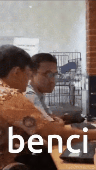 Two Men Sitting At A Table Saying Bench GIF