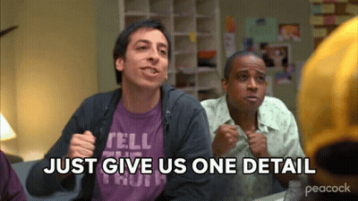 Two Men Sitting At A Table With The Words Just Give Us One Detail GIF