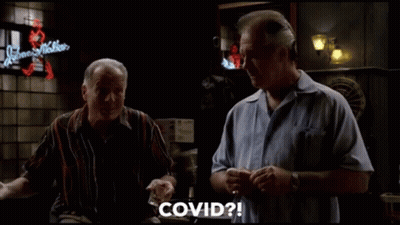 Two Men Sitting At Bar Talking GIF