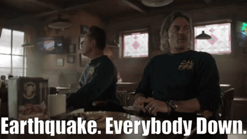 Two Men Sitting At Bar With Earthquake Everybody Down GIF