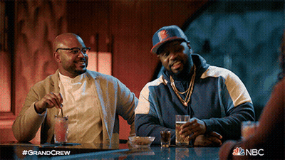 Two Men Sitting At Bar With NBC GIF