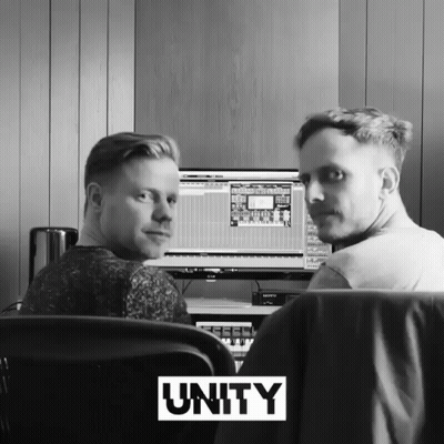 Two Men Sitting at Computer With Unity Above