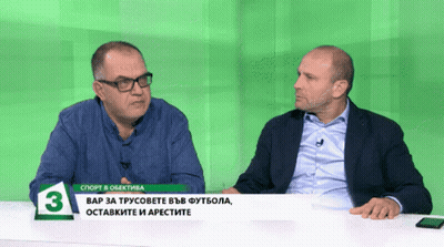 Two Men Sitting At Green Table Number 3 GIF