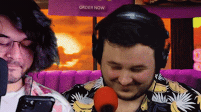 Two Men Sitting At Microphone GIF