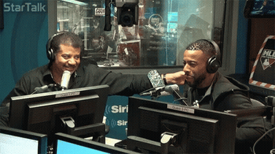 Two Men Sitting At Microphone In Star Talk Studio GIF
