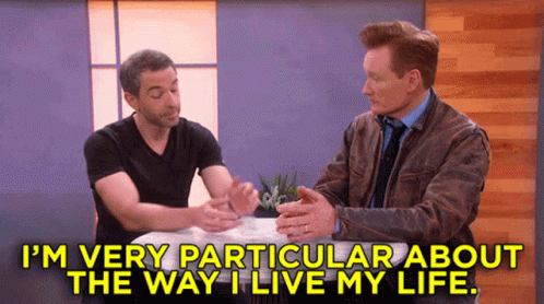 Two Men Sitting At Table GIF