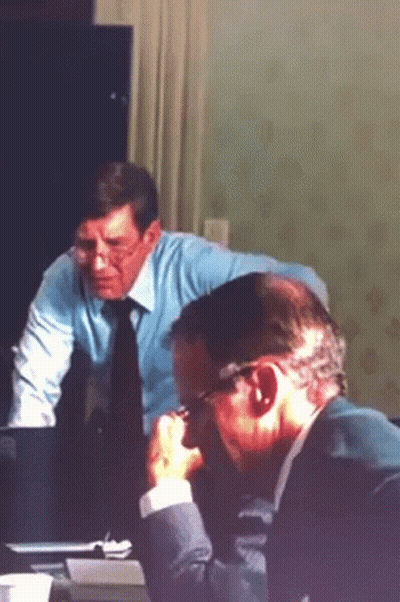Two Men Sitting At Table Glasses And Blue Shirt Tie GIF