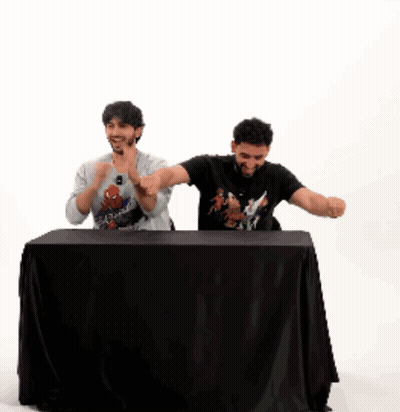 Two Men Sitting At Table One Pointing GIF