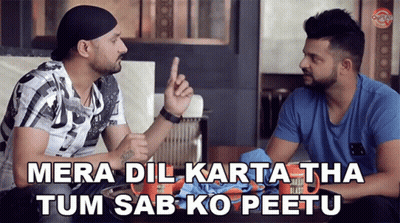 Two Men Sitting At Table One Pointing GIF