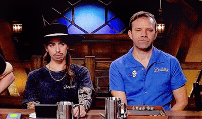 Two Men Sitting At Table One Wearing Daddy Shirt GIF