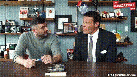 Two Men Sitting at Table With AskGaryVee Sign
