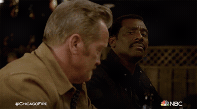 Two Men Sitting At Table With Beer #Chicagofire GIF