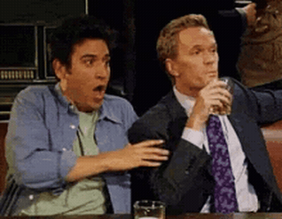 Two Men Sitting At Table With Beer GIF