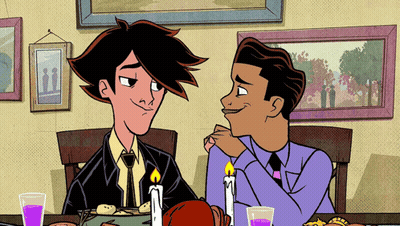Two Men Sitting At Table With Candles GIF