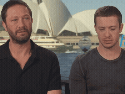 Two Men Sitting Eyes Closed GIF