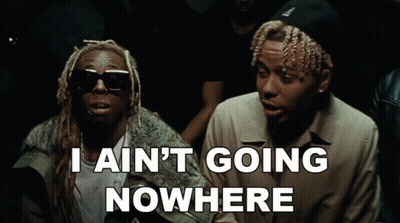 Two Men Sitting I Ain't Going Nowhere GIF