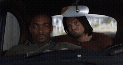 Two Men Sitting In Back Seat Looking Out Window GIF