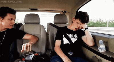 Two Men Sitting In Back Seat Of Car GIF