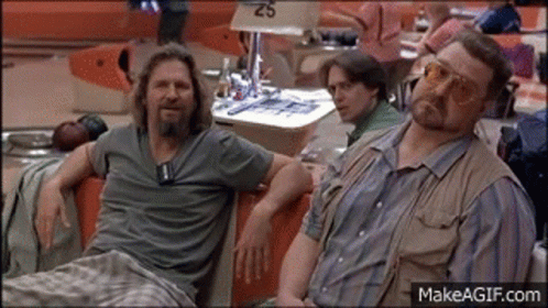 Two Men Sitting In Bowling Alley GIF