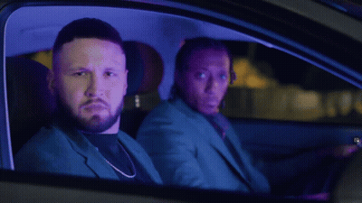 Two Men Sitting In Car At Night With Dreadlocks GIF