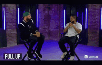 Two Men Sitting In Chairs GIF