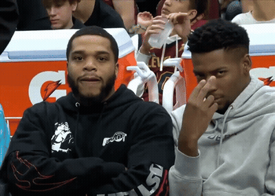 Two Men Sitting In Front Of An Orange Gatorade Box GIF