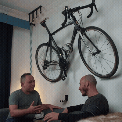 Two Men Sitting In Front Of Bicycle With Scott GIF