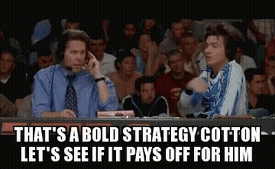 Two Men Sitting In Front Of Crowd One Talking On Phone GIF