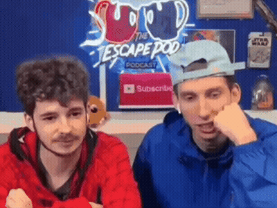 Two Men Sitting In Front Of Escape Pod Podcast Sign GIF