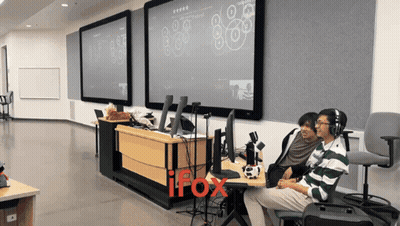 Two Men Sitting In Front Of IFox Screen GIF