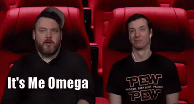 Two Men Sitting In Red Seats One In Pew Shirt GIF