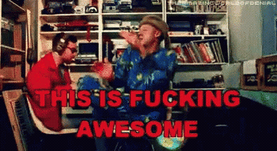 Two Men Sitting In Room Saying This Is Fucking Awesome GIF