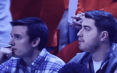 Two Men Sitting In Stadium Watching Game GIF
