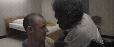 Two Men Sitting Next To Bed GIF
