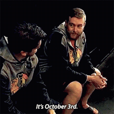 Two Men Sitting Next To Each Other Saying It's October 3Rd GIF