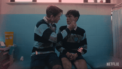Two Men Sitting Next To Each Other With A Netflix Logo On The Bottom GIF