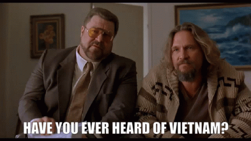 Two Men Sitting Next To Each Other With The Words Have You Ever Heard Of Vietnam On The Bottom GIF