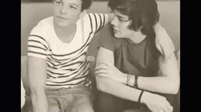 Two Men Sitting On A Couch GIF