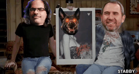 Two Men Sitting On A Couch Holding A Picture Of A Dog With Red Eyes GIF