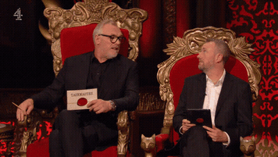 Two Men Sitting On A Throne With A Sign That Says Taskmaster GIF