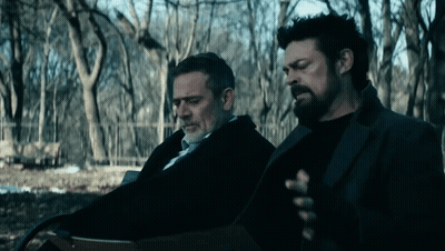 Two Men Sitting On Bench In Park GIF