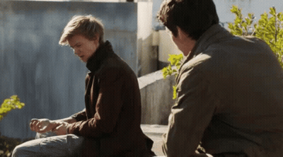 Two Men Sitting On Bench Talking GIF