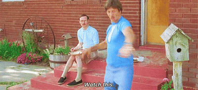 Two Men Sitting On Brick Porch Saying Watch This GIF